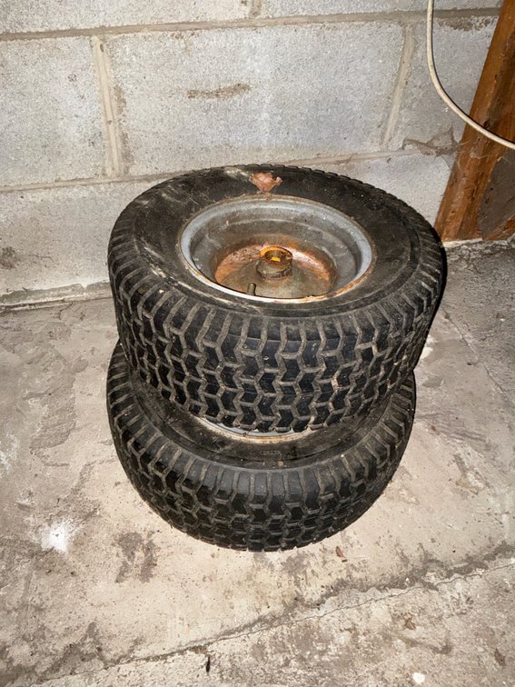 Two Lawnmower Turf Tires on Metal Wheels