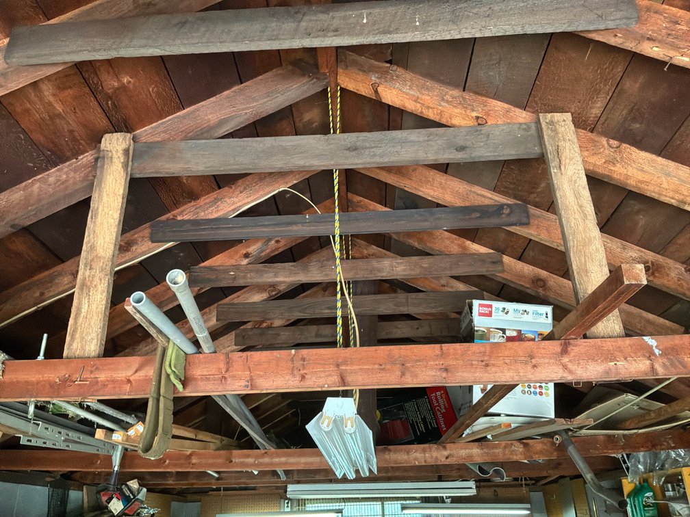 Garage Rafter Storage Contents with Conduit and Lumber