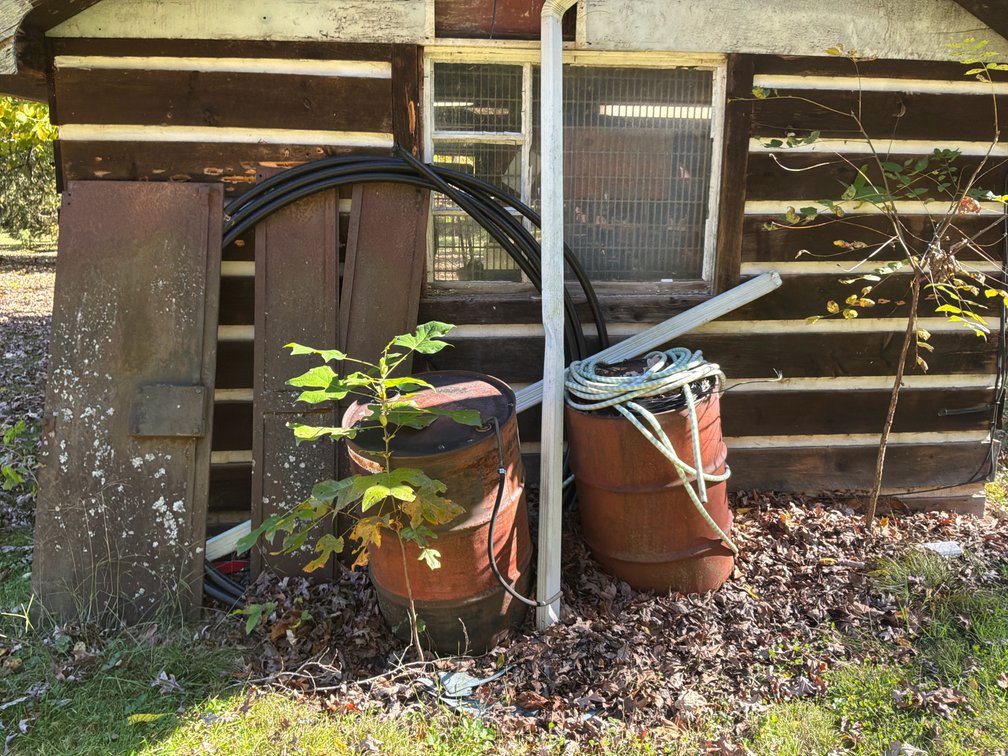 Solid Steel Doors, Metal Drums, and Water Pipe