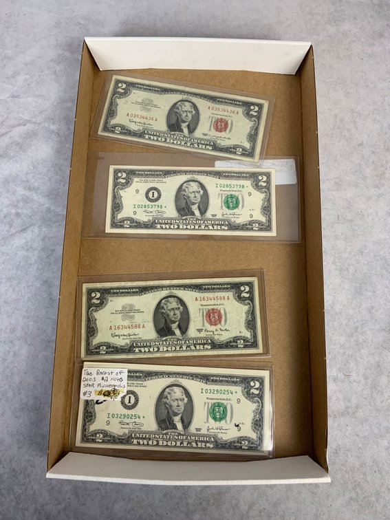 Four U.S. $2 Banknotes in Protective Sleeves