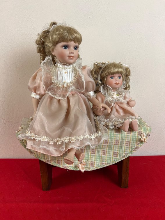 Porcelain Doll Pair on Wooden Bench