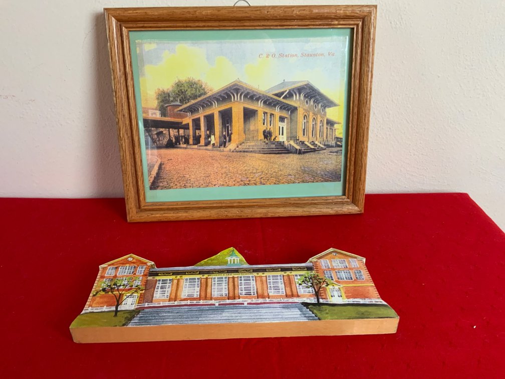 Framed Artwork and Painted Wooden Building
