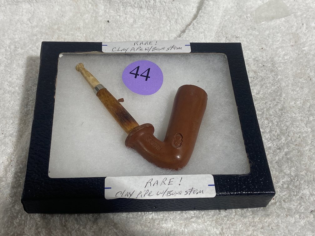 Clay pipe and bone pipe