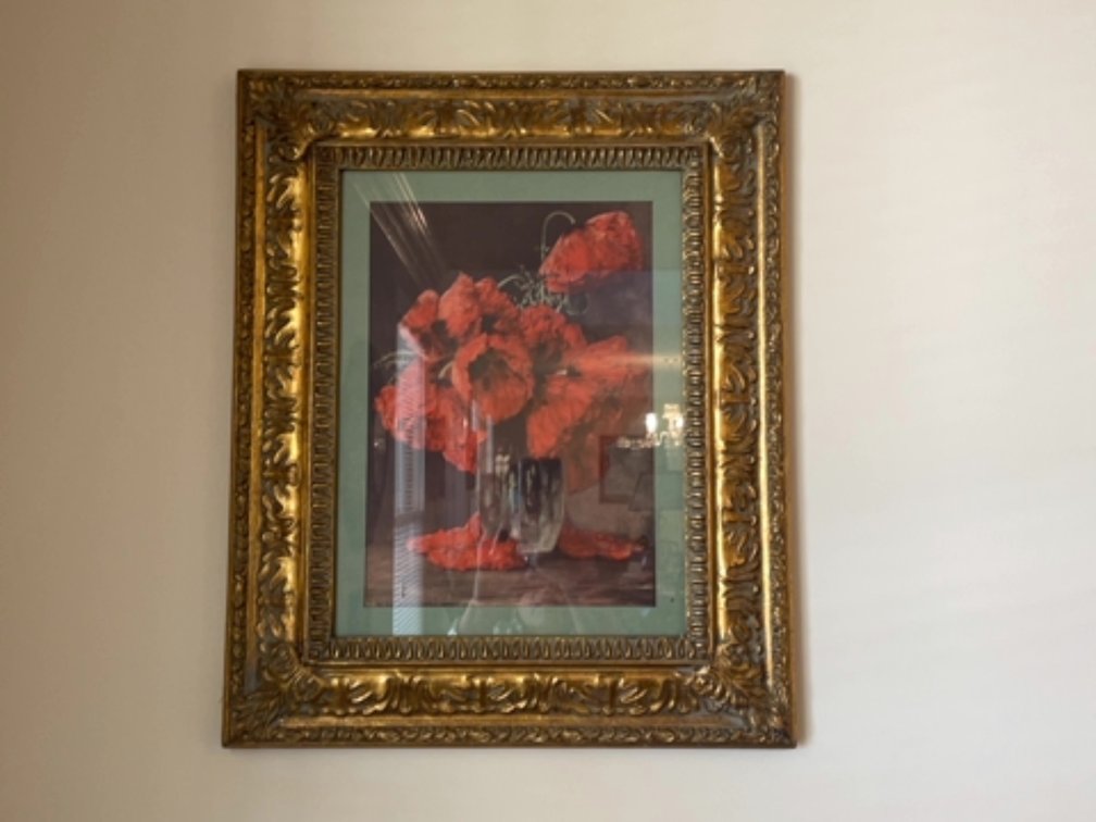 Floral prints in matching gilded frames