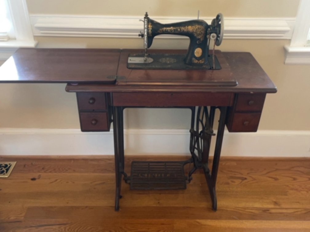 Antique Singer sewing machine and cabinet