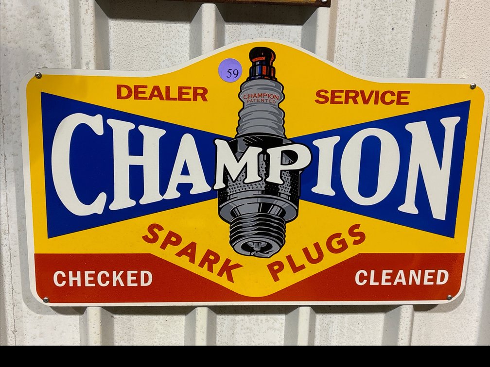Champion Spark Plugs metal sign; 24” x 15”