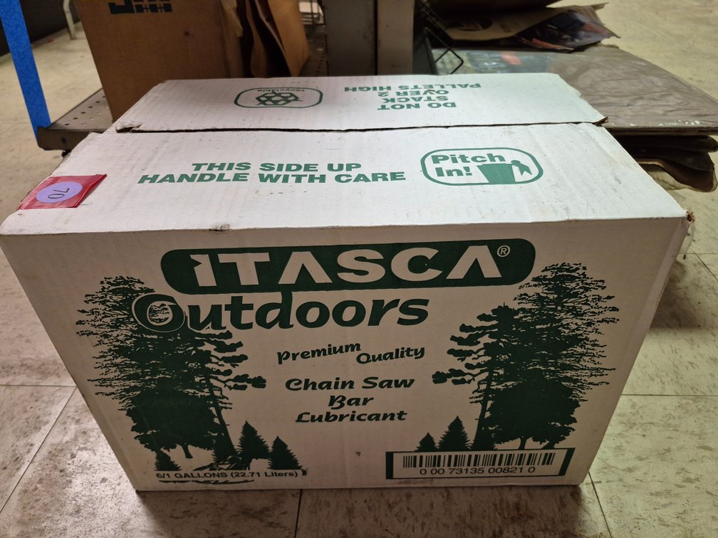 Unopened case of Itasca chainsaw bar oil