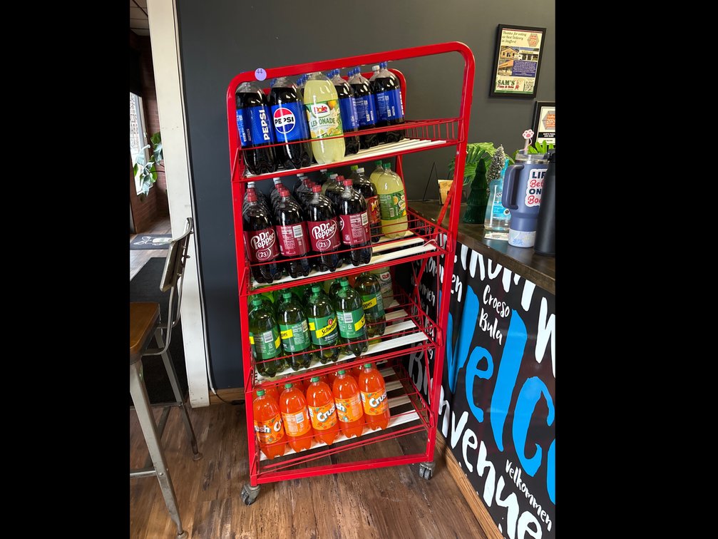 Red metal rack; 26” x 30” x 65” tall; casters