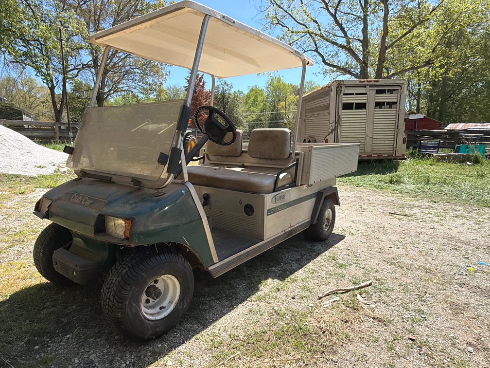 Club Car Carryall Turf 2 utility vehicle features an aluminum frame and hydraulic dump bed