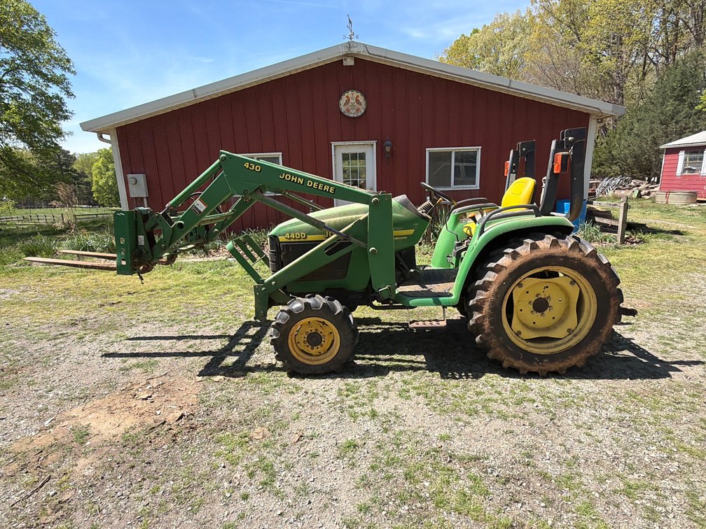 John Deere 4400 with a 430 loader comes with forks
