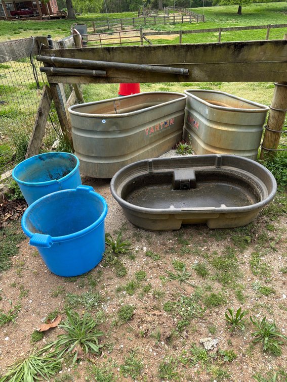 (2) galvanized metal stock tanks, (1) rubber stock tank, (4) feeding buckets lot