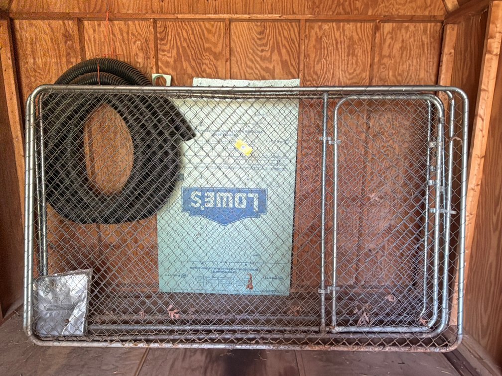 (4) 10’ x 6’ adjustable chain-link gate kit, small grey tarp, insulation board, and 4” roll of corrugated single-wall solid drainage pipe