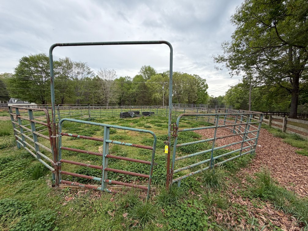 Metal horse corral with metal stock tank lot