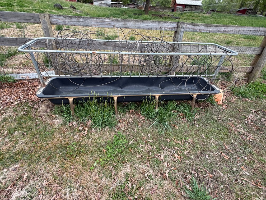 metal livestock bunk feeders with a V-shaped hay rack, and 2 stock tanks
