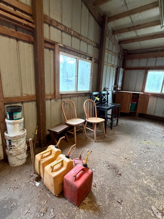 Gas cans, chairs, large animal scale, small corner storage cabinet piece, etc
