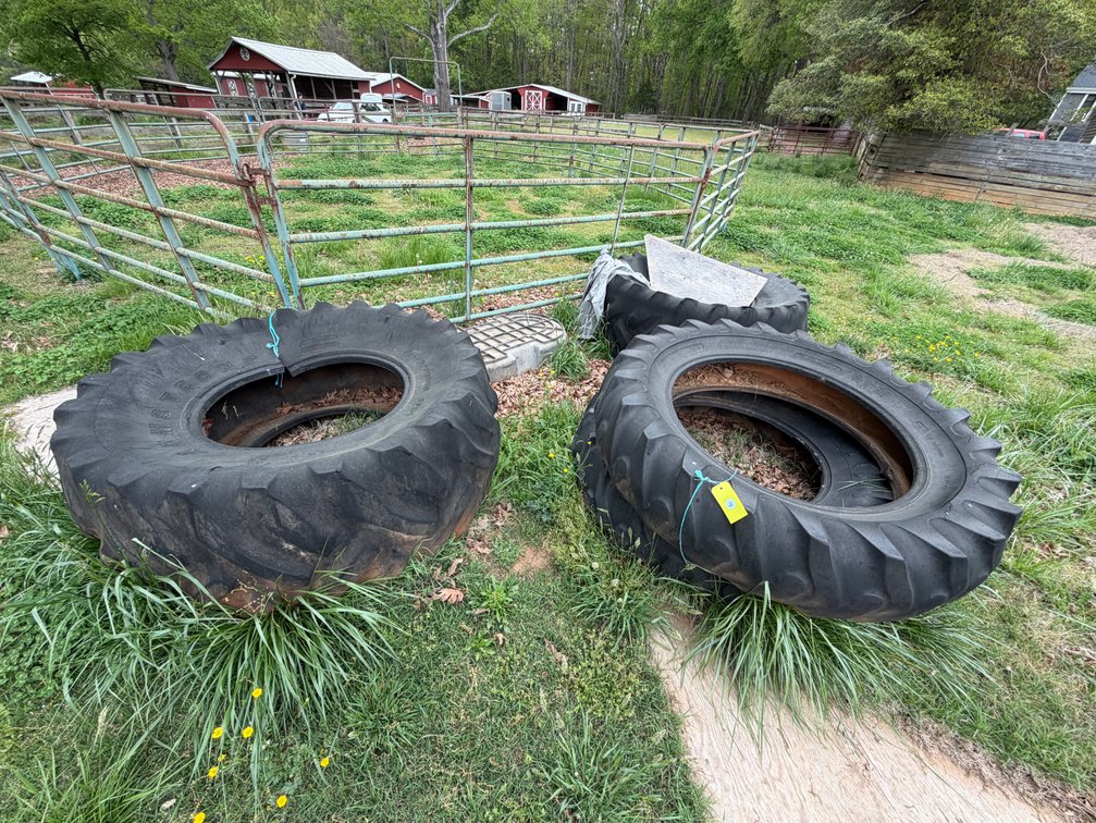 Several old tractor tires, great for working out (flipping, hitting with sledgehammer, etc), or cutting up and using for different uses. Water stock tank included in lot
