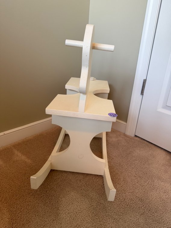 A white wooden rocking horse for toddlers
