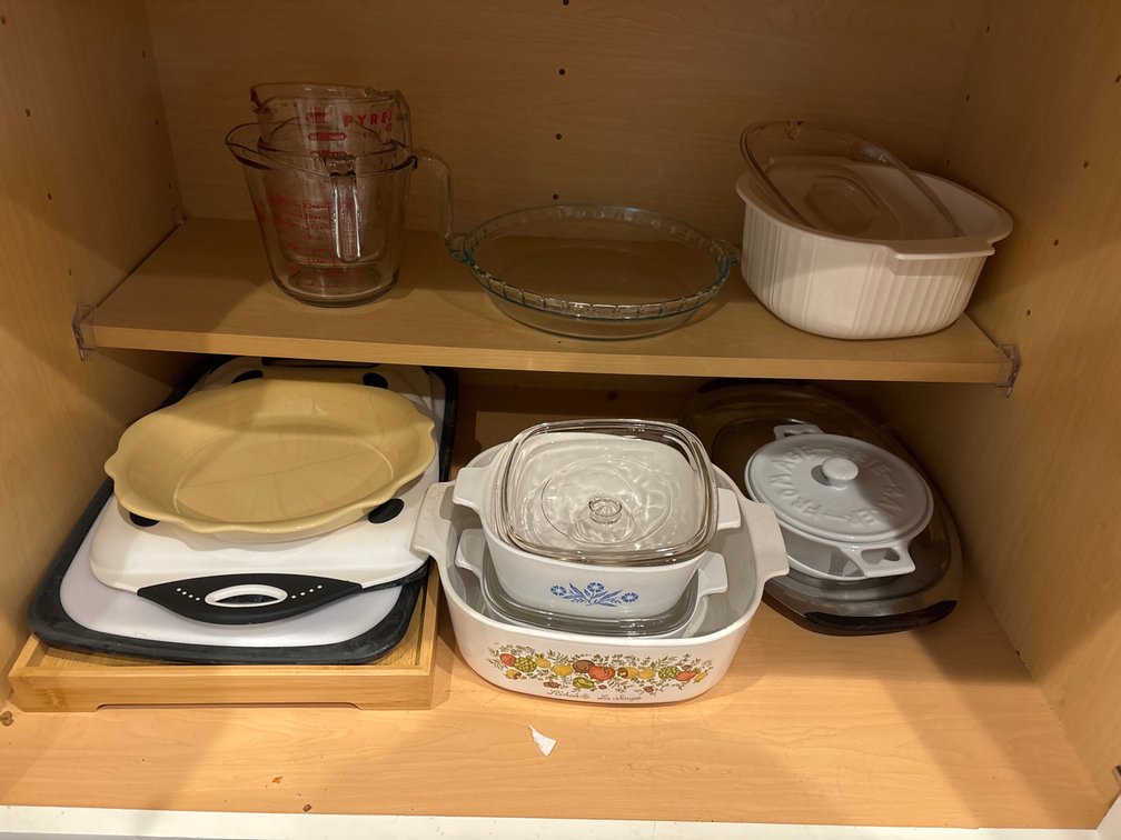 Lower cabinet lot: Corningware, Pyrex, etc