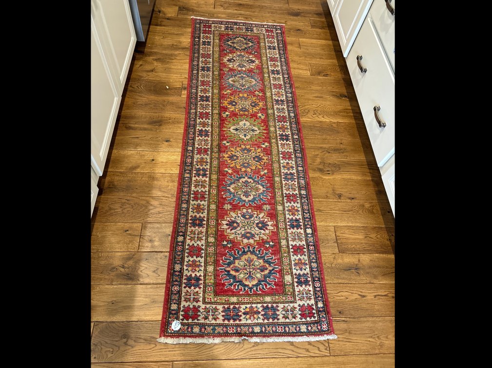 2 wool area rugs; runner is 2’ x 6’; other rug is 2’ x 3’