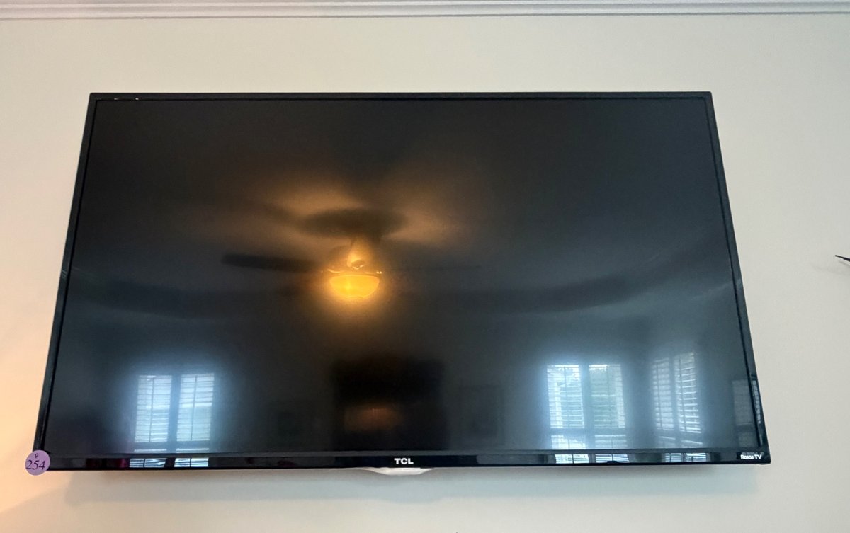 42” wall-mounted TCL Roku Smart LED TV