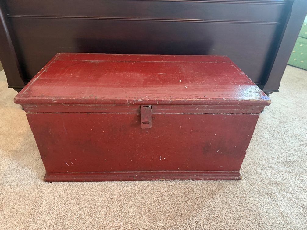 An antique wooden carpenter's tool chest