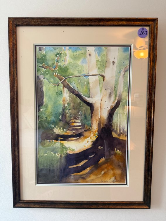 A framed watercolor landscape painting