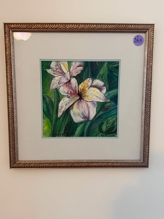 A framed, matted floral watercolor or pastel painting