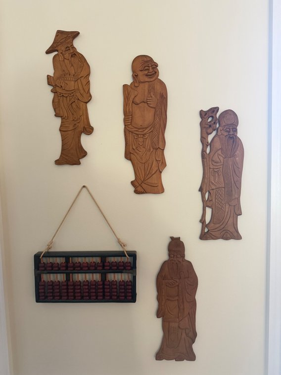 (4) Vintage hand-carved wooden wall figurines and vintage Chinese abacus