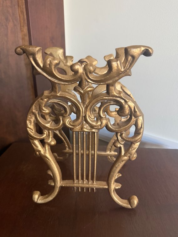 A vintage gold-toned cast iron or cast metal lyre harp