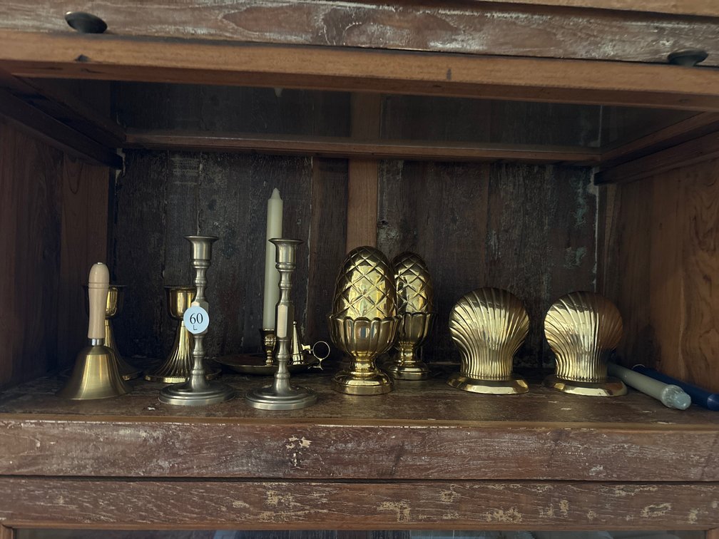 Brass lot: bookends, candleholders, bell