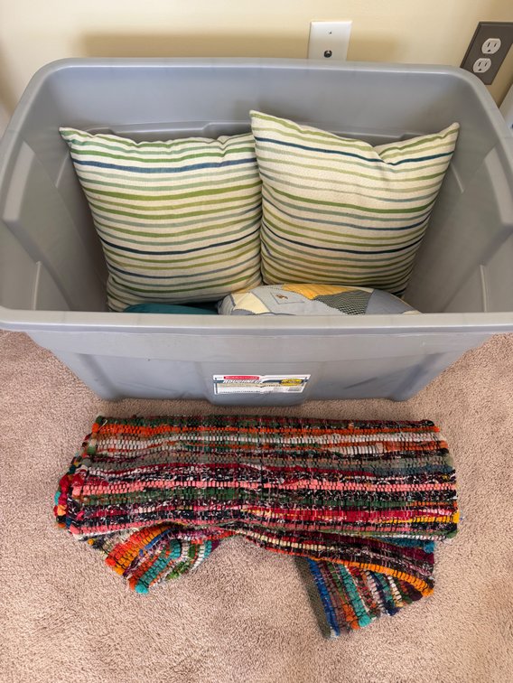 Pillows, rug, hand bag, etc lot