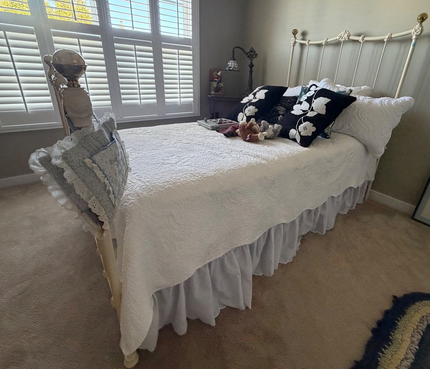 Antique style metal and brass bed frame, children’s plush toys, etc