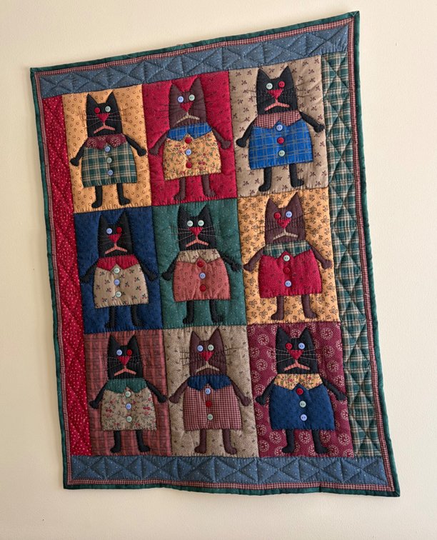 Handmade patchwork and appliqué wall hanging quilt