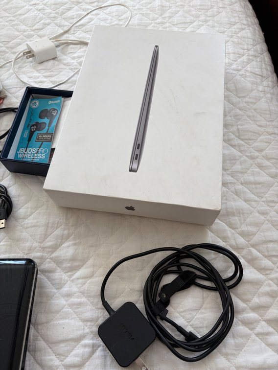 Miscellaneous charging cords, old computer (unknown working condition), etc