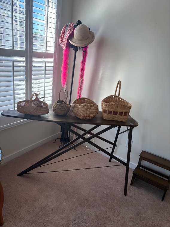 Vintage wooden ironing board, vintage baskets, coat rack, etc