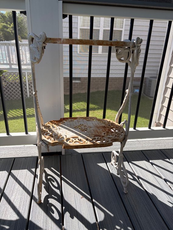 A two-tier white cast iron plant stand