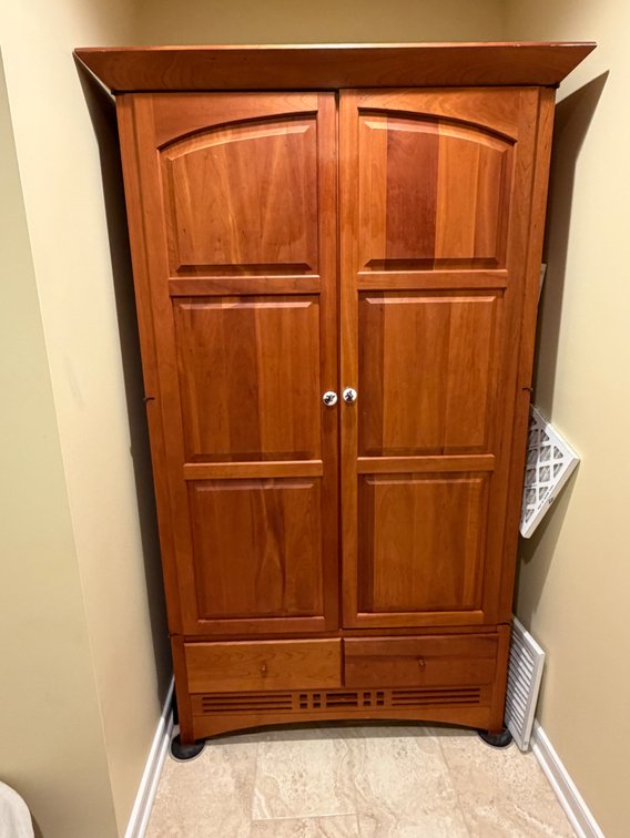 A wooden two-door armoire