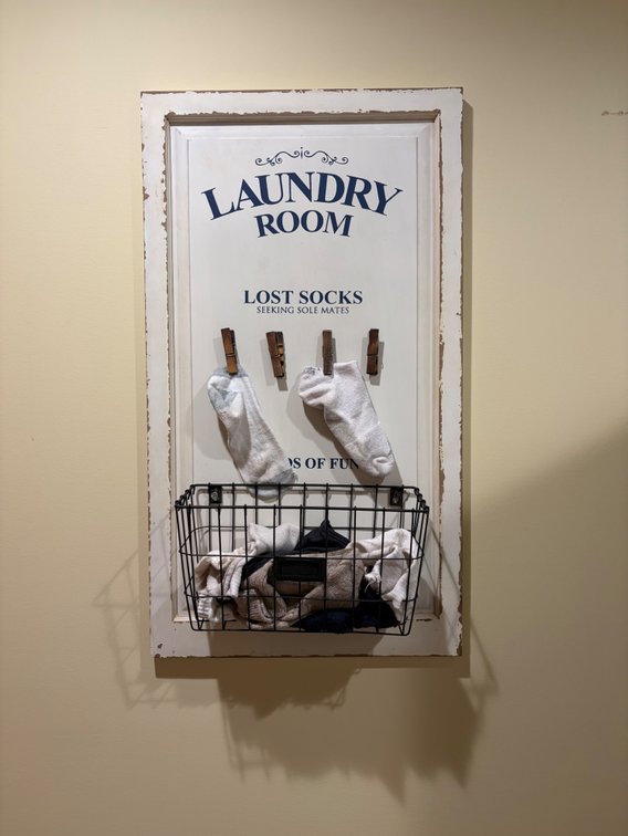 Decorative wooden wall organizer for lost socks with attached wire storage