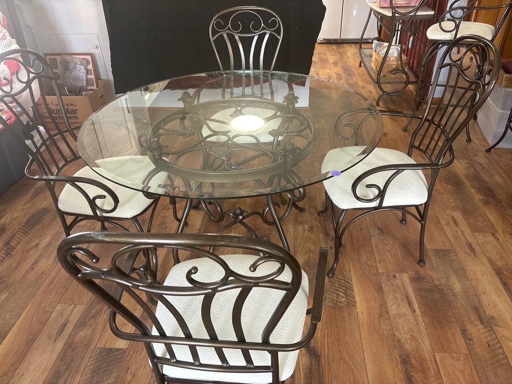 Glass and metal dining table and 4 chairs; 50” in diameter