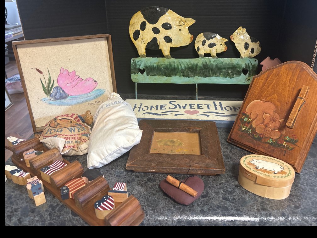 Collection of rustic wood and metal decor, mostly pig themed