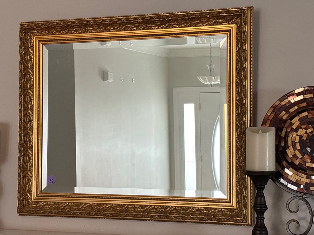 Beveled overmantle mirror; gilt frame