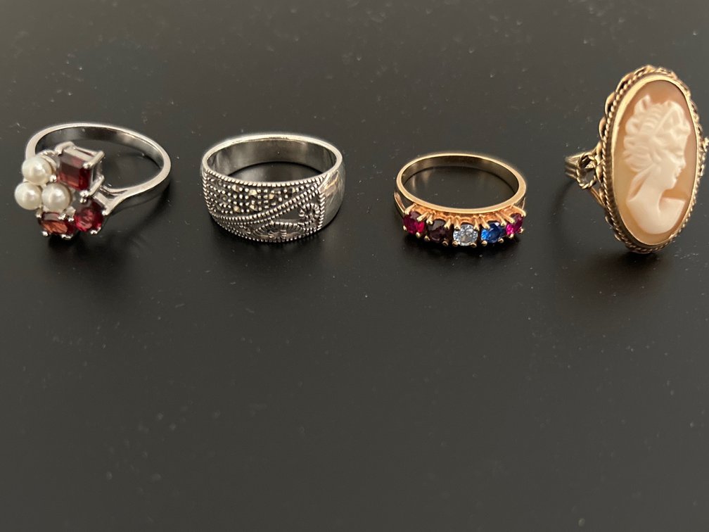 4 rings; 2 are sterling; other 2 not marked