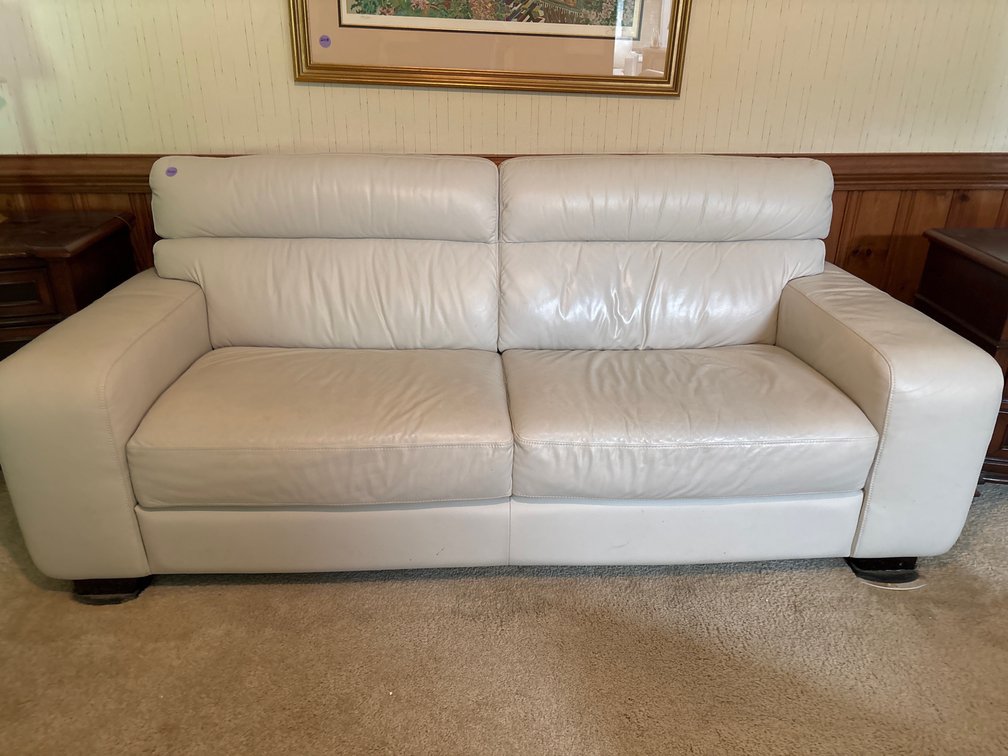 Ivory leather sofa; 86” x 36” x 34” high