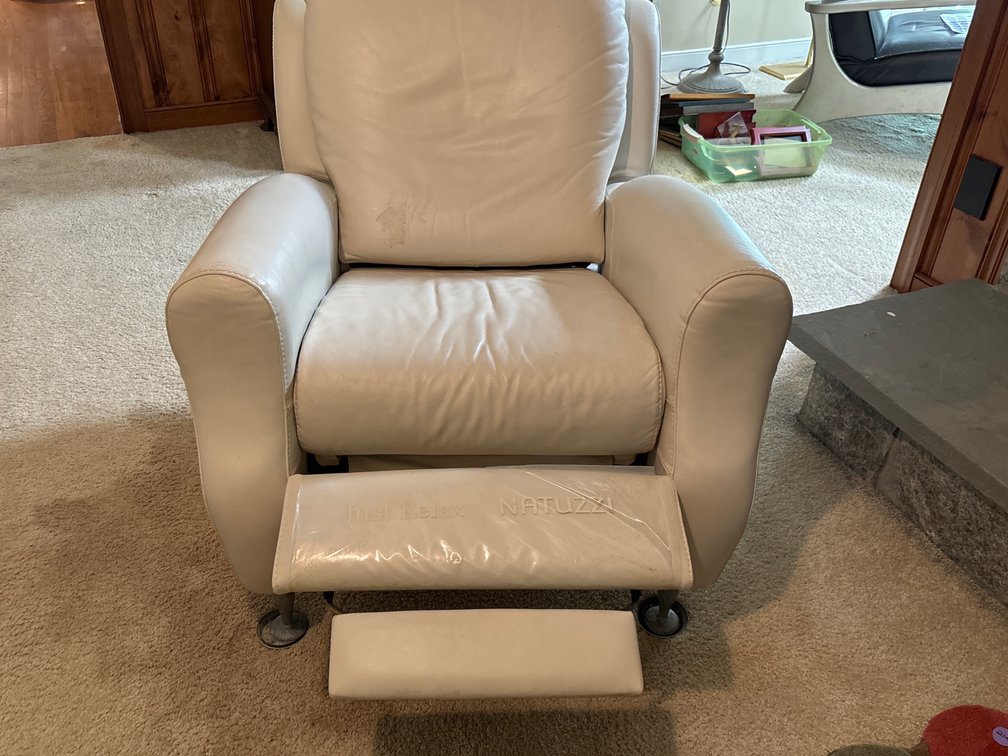 Ivory leather recliner by Natuzzi; 34” wide