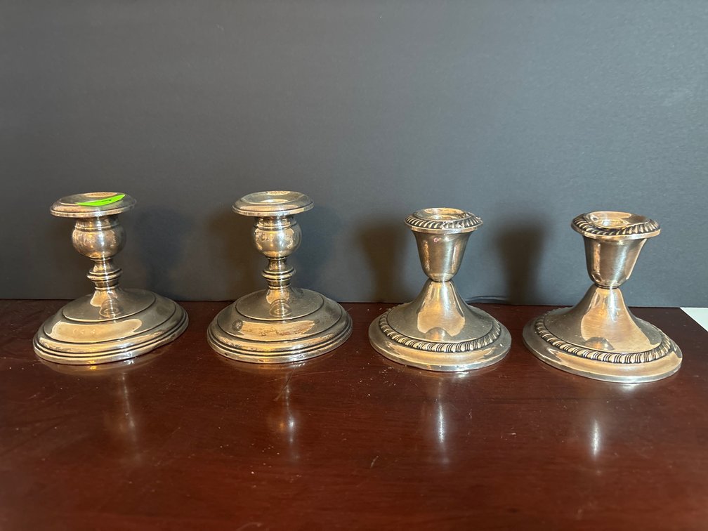 Pairs of sterling weighted candle holders; 4” tall