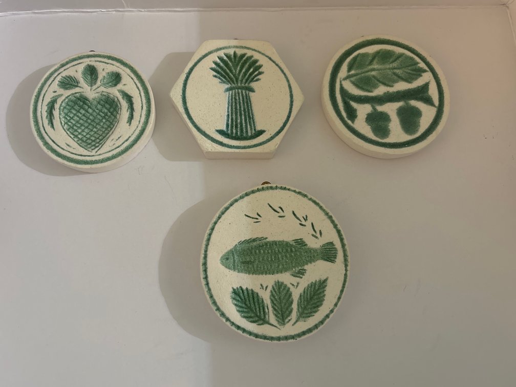 4 plaster casts of antique butter molds; painted, w/ hanger