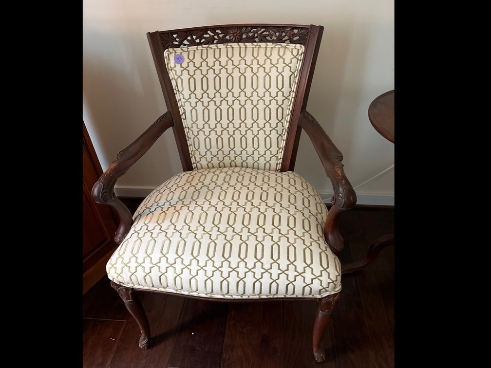 Antique carved armchair with new olive and cream upholstery