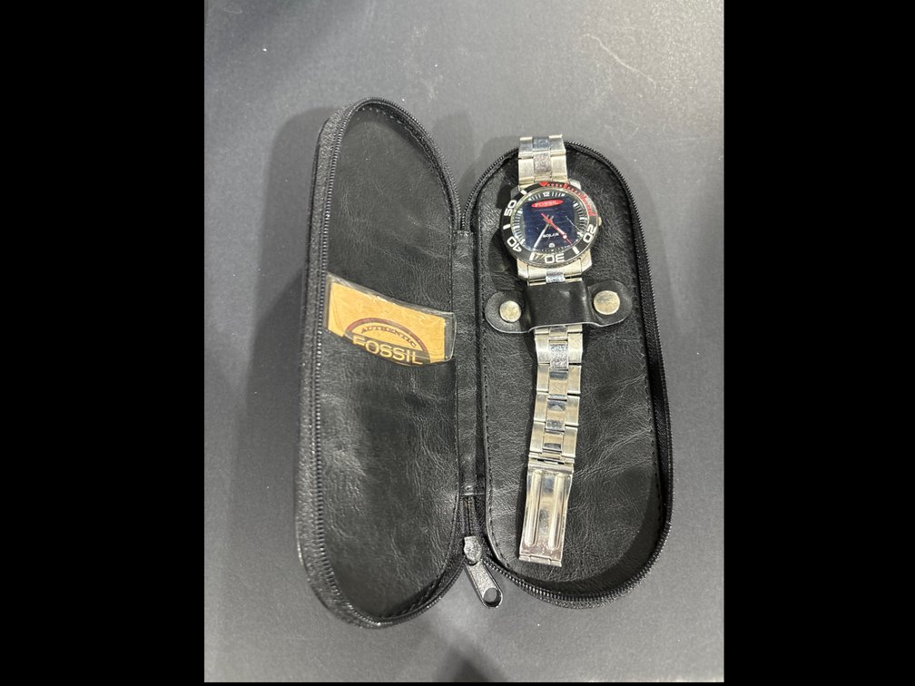Fossil solar watch in leather case, running