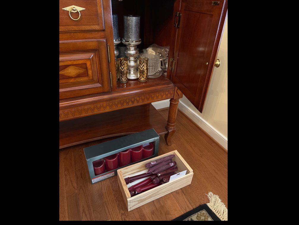 Candle lot: in dining room sideboard and on floor