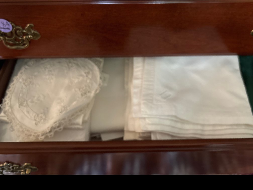 Contents of drawers in highboy: table linens